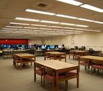 interior view of the Commons showing rows of computers and an area containing tables and chairs