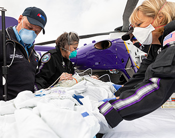 Emergency workers with patient.