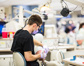 A dentist working on a patient