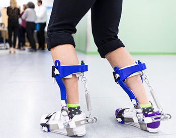 Closeup of a patient using braces on their lower legs.