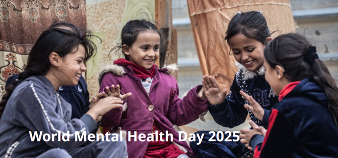 Group of smiling young girls playing hand game.